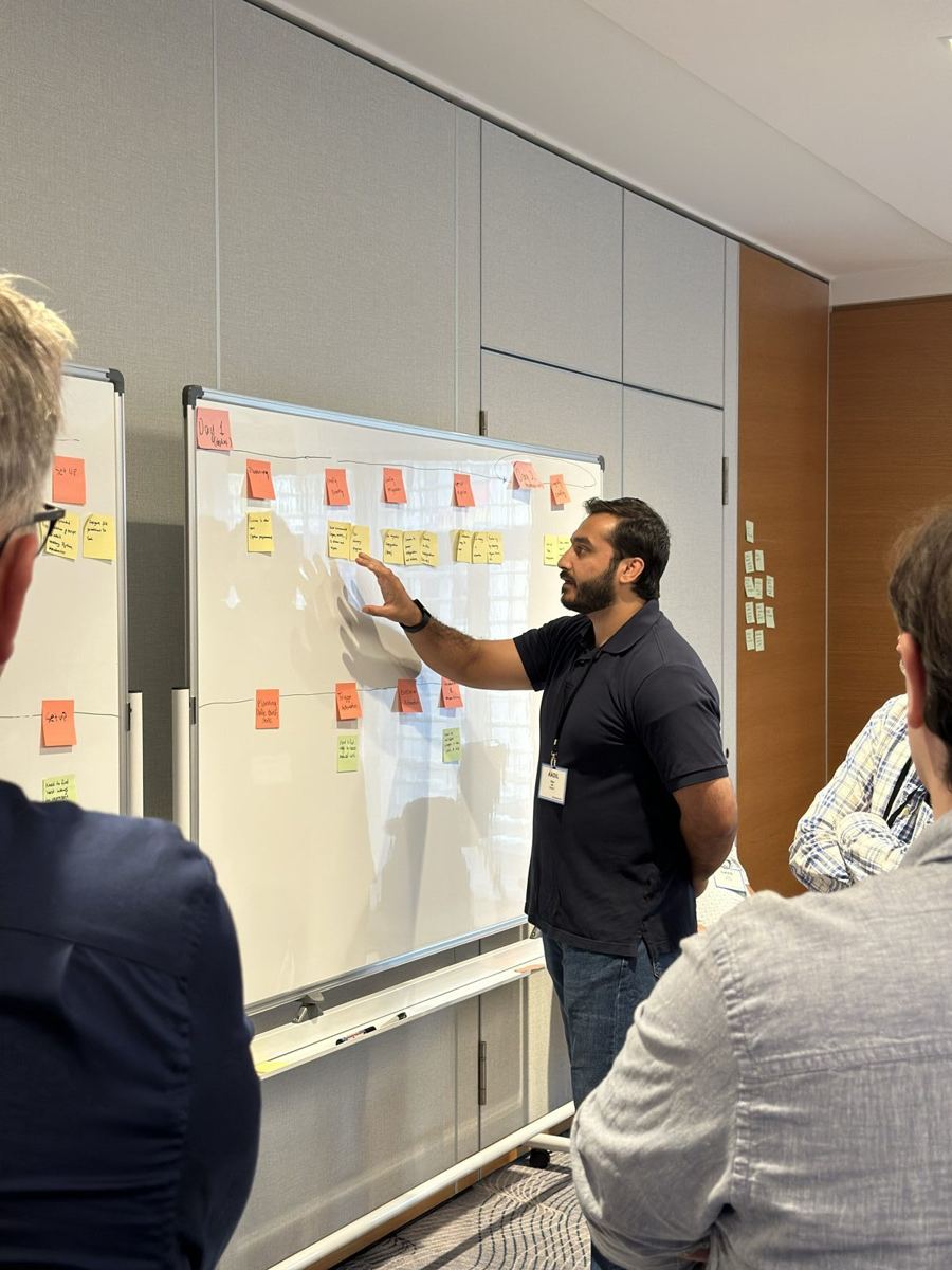 Aadil leading a hands-on sticky-note workshop